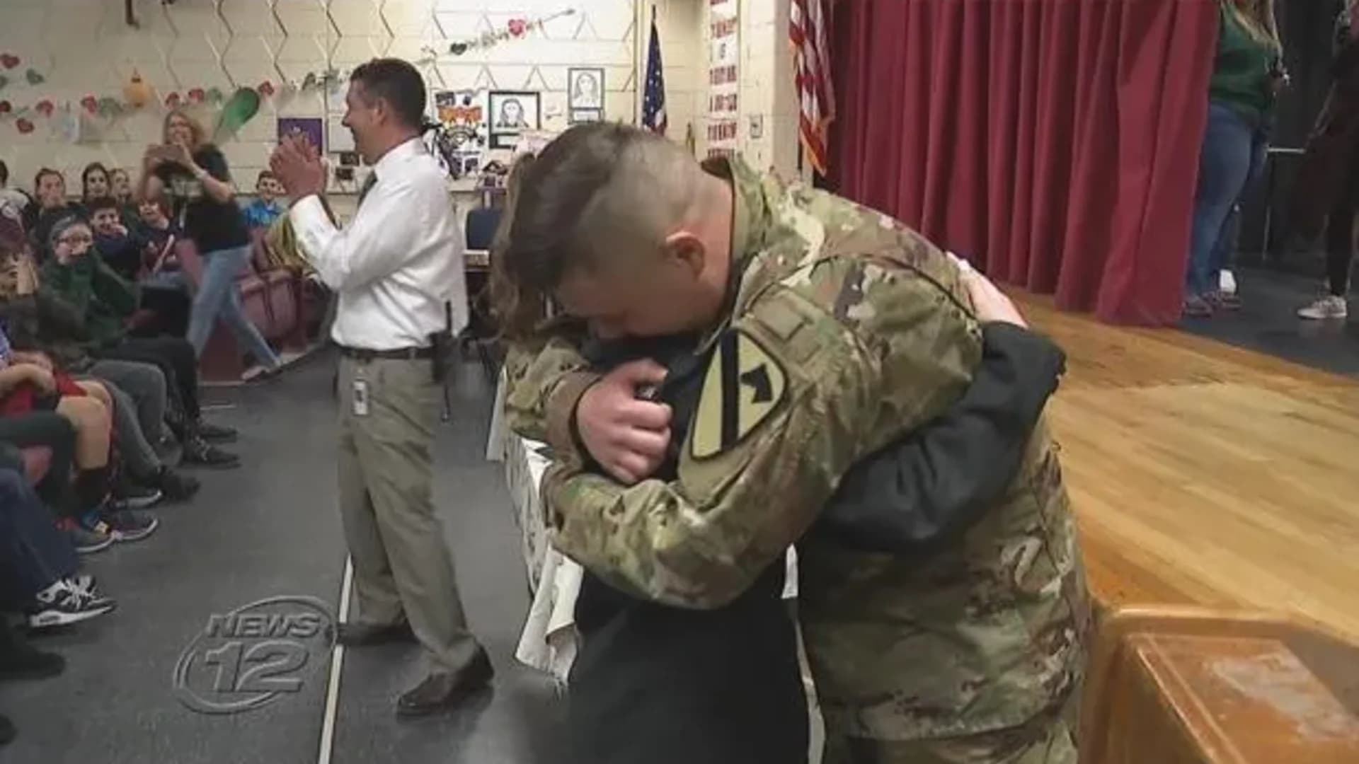 Military brother surprises younger sister at school assembly