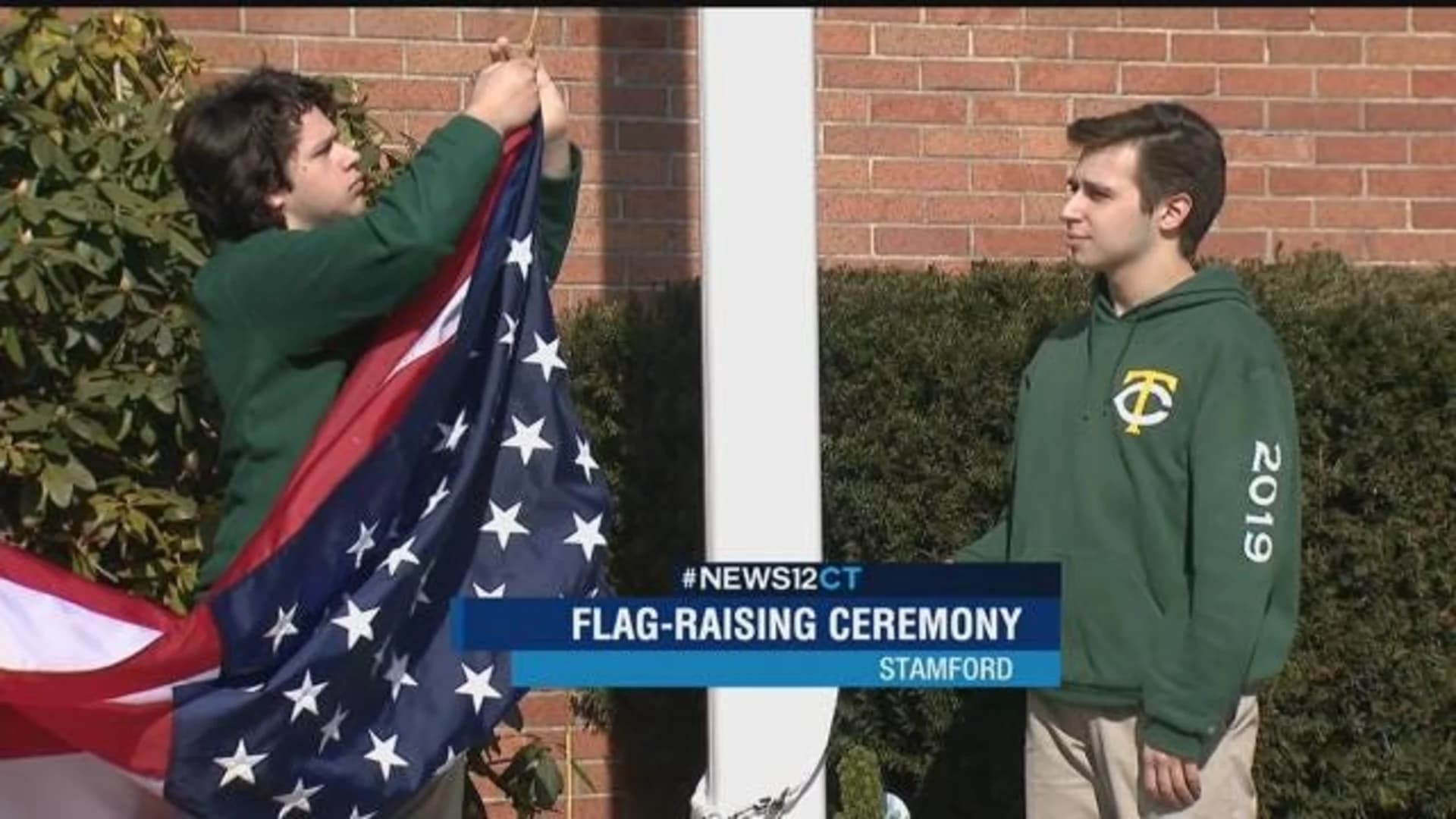 Stamford Trinity Catholic celebrates new renovations with flag-raising ceremony