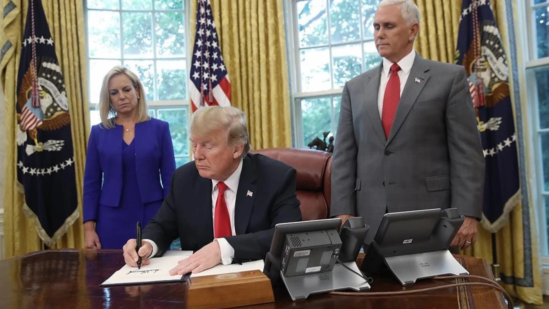 In reversal, Trump signs order stopping family separation
