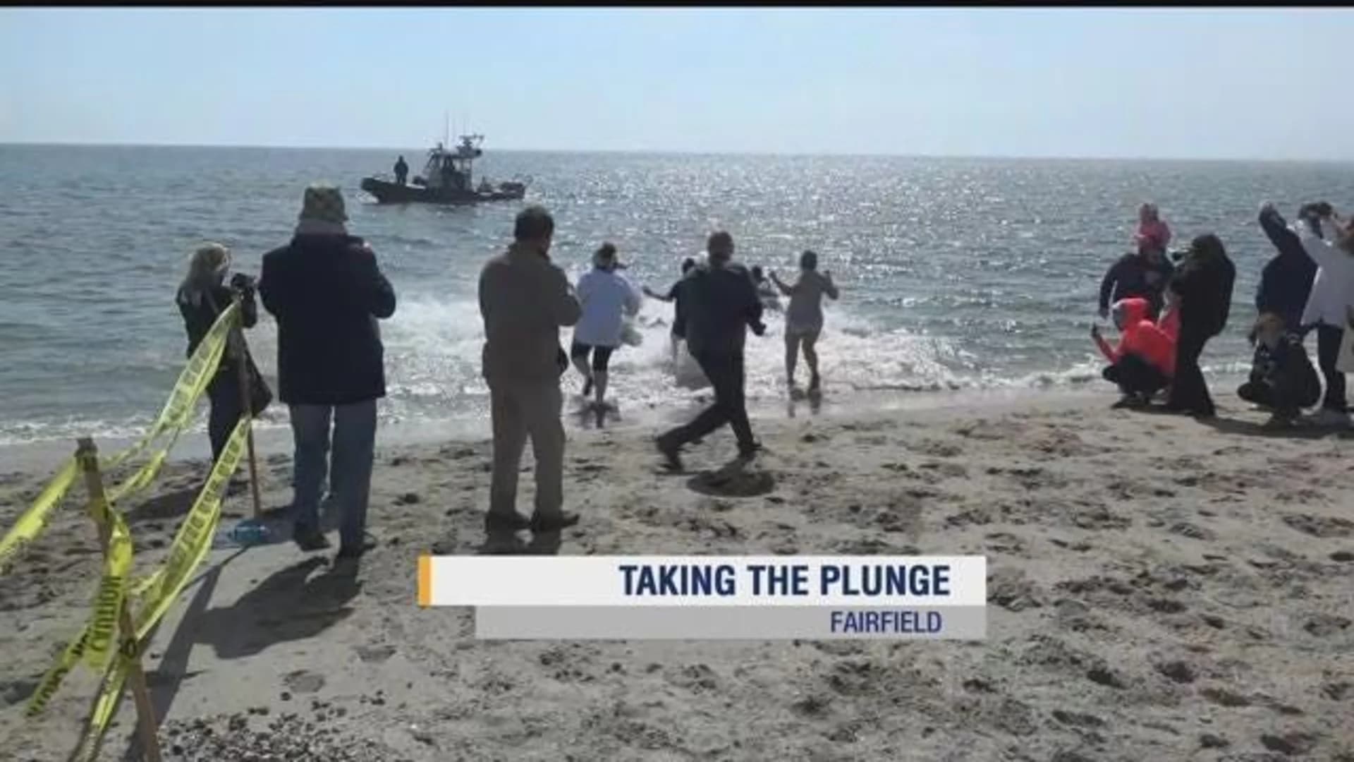 Penguin Plunge participants dive in to support the Special Olympics