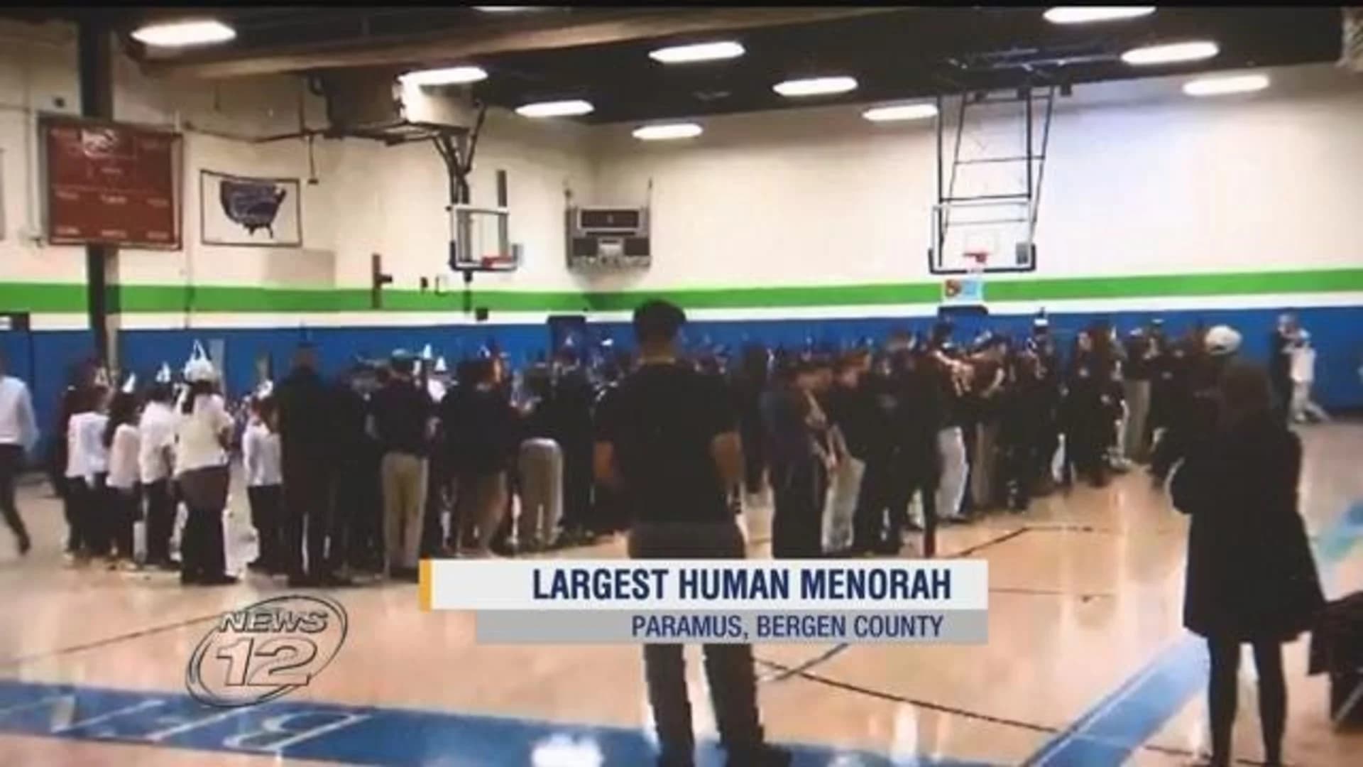 Students attempt to break record for largest human menorah