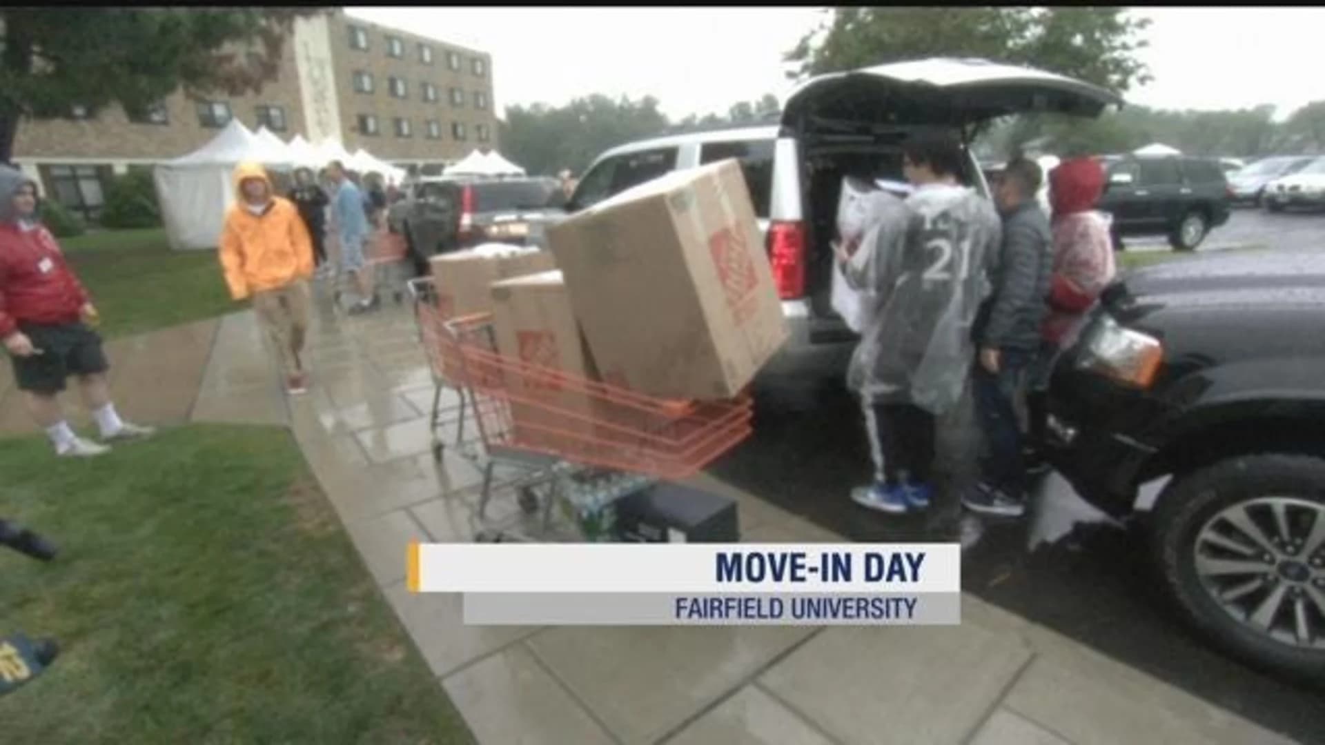 Families battle pouring rain for Fairfield U. move-in