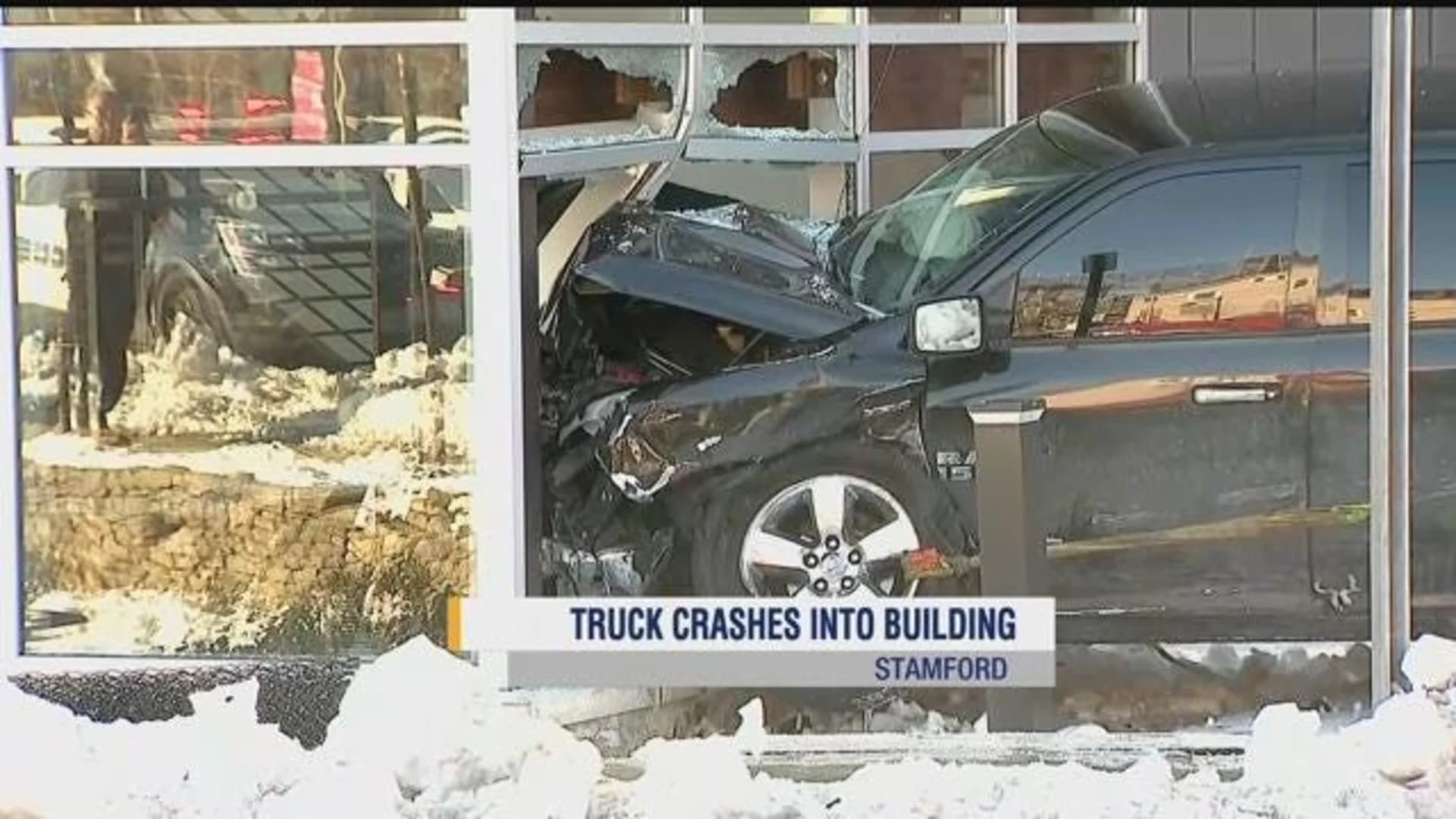 Police: 1 hospitalized when car slams into Stamford building