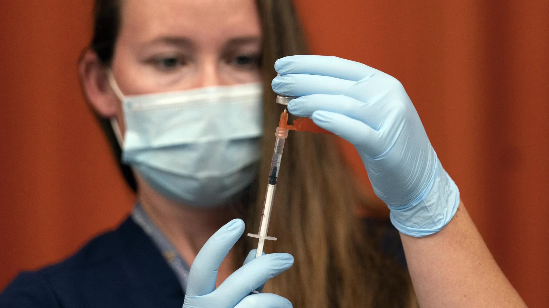 US hits 70% vaccination rate -- a month late, amid a surge
